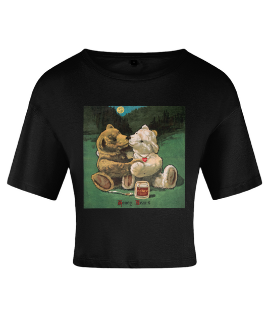 A black crop top with a graphic of two bears and a honey jar under the moonlight. On a white backdrop.