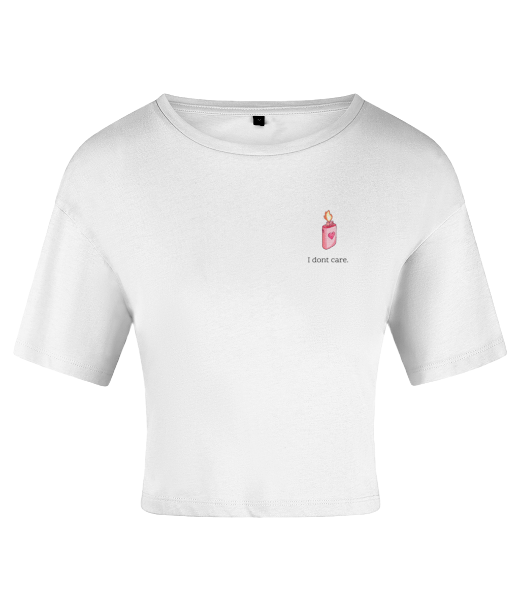 A white crop top with a crew neckline and short sleeves, featuring a sketch-style lighter design in pink and the text 'I don't care' on the chest. On a white backdrop.