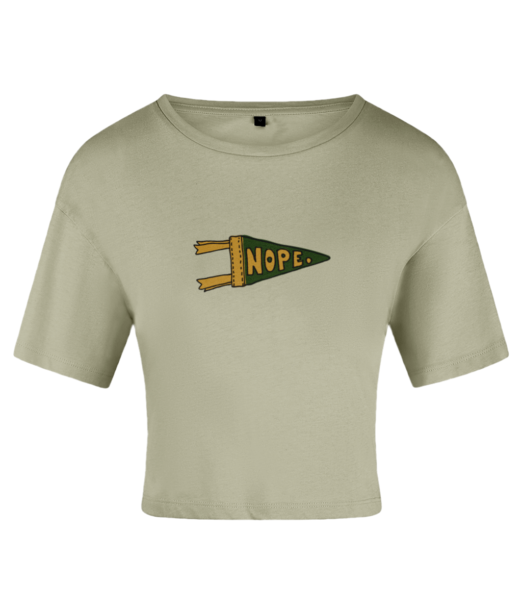 A green crop top with a pennant graphic that has the word 'NOPE' written in a bold lettering style. On a white backdrop.
