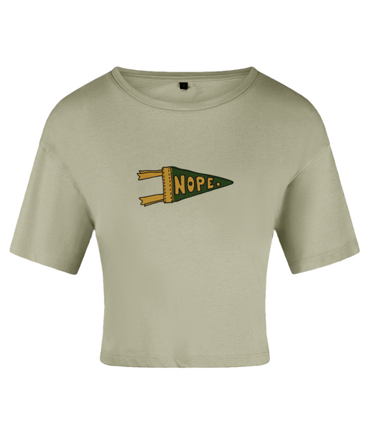A green crop top with a pennant graphic that has the word 'NOPE' written in a bold lettering style. On a white backdrop.