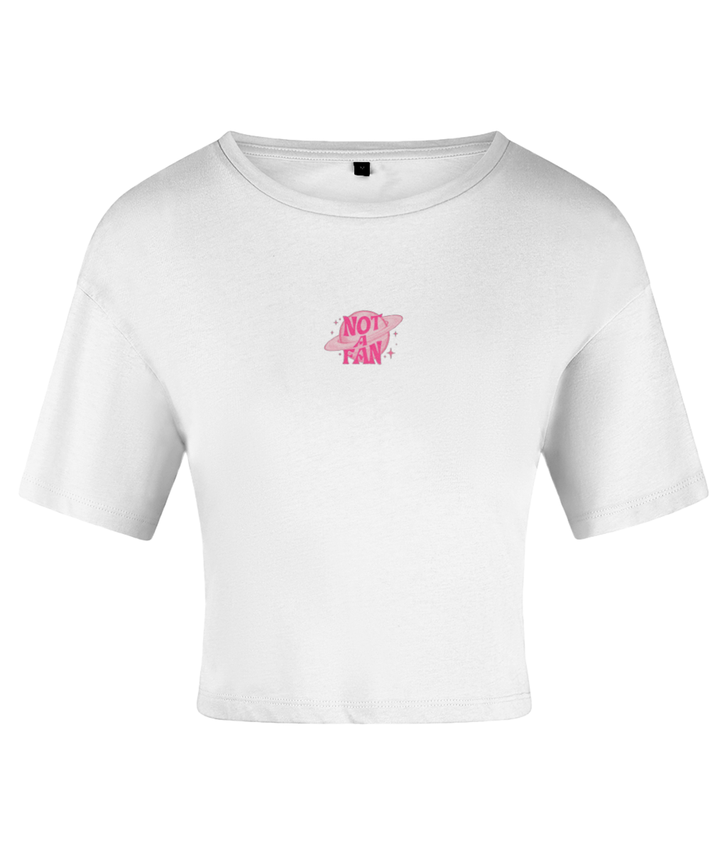A white crop top with a pink graphic that reads 'Not a Fan' and features a pink planet accent. On a white backdrop.