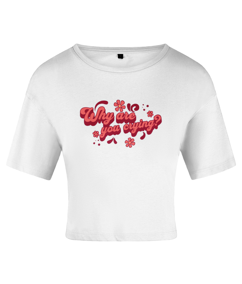A white crop top with the text 'Why are you crying?' written in a bold red font, accented with red flowers. On a white backdrop.